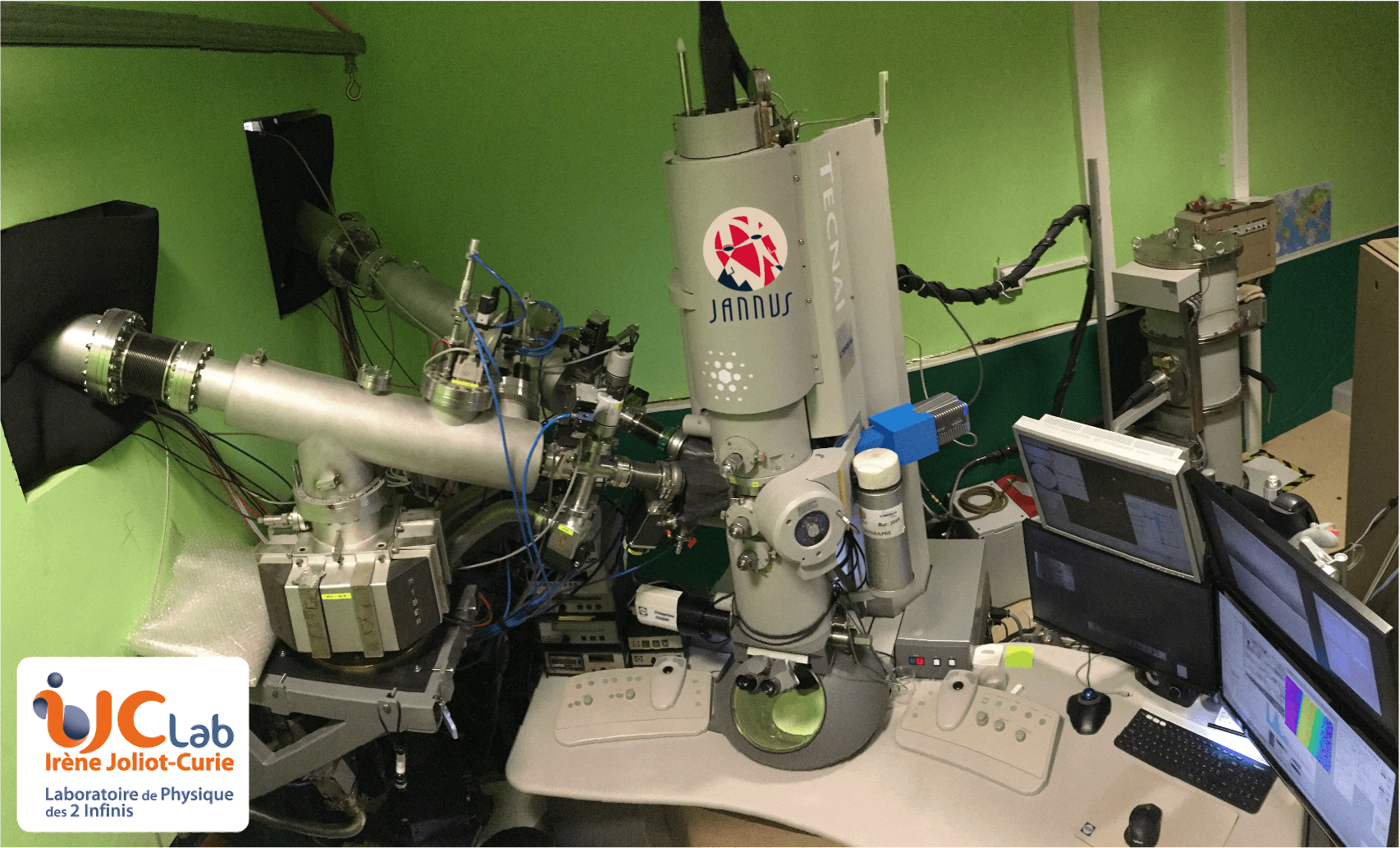 Overview of the Transmission Electron Microscope with its two ion beam connections seen on the left (© C. Baumier)